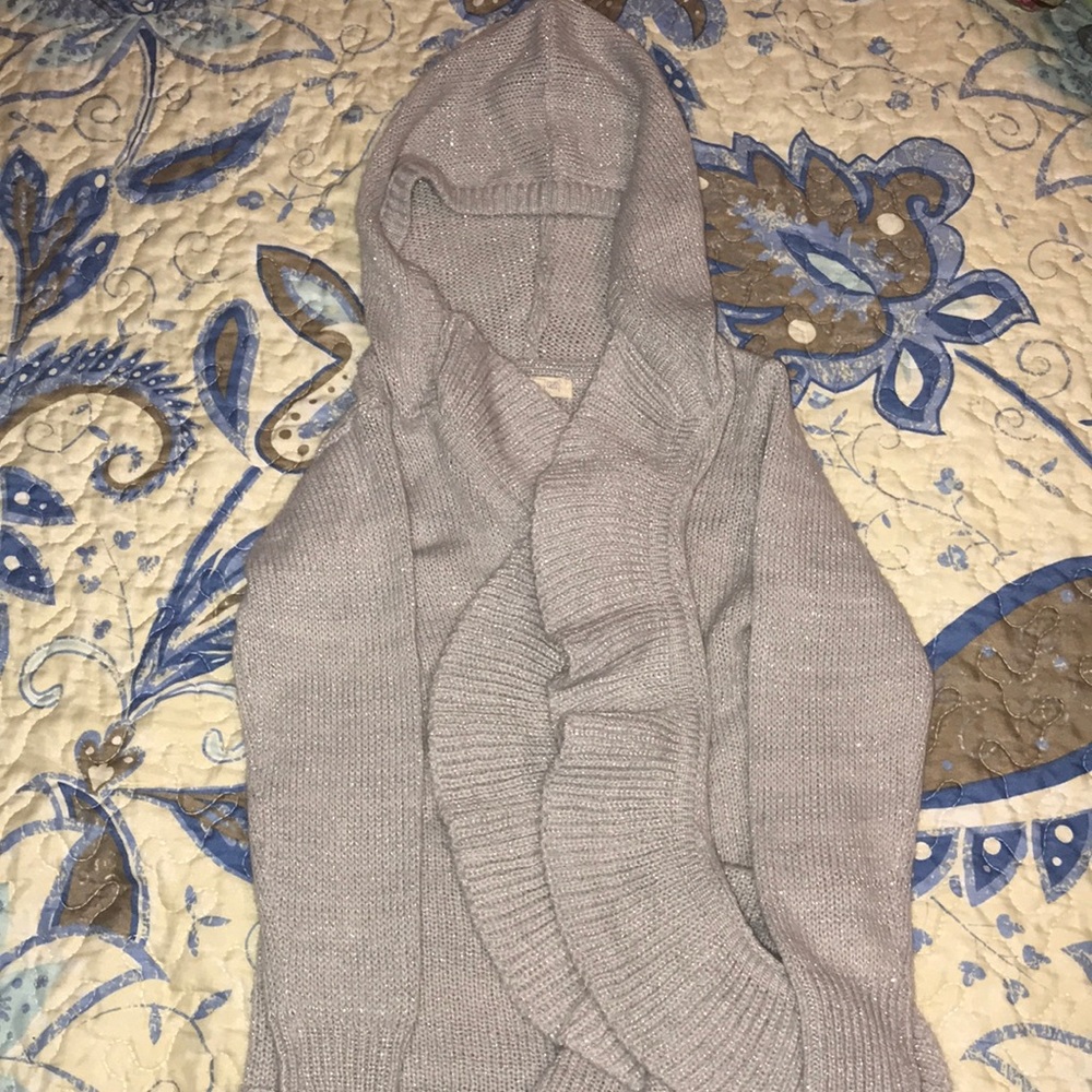 Cute sparkle sweater with ruffled opening